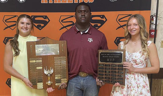 TRACK – (from left) Landry Zapalac, Rotary Club Outstanding Female Track Athlete; Tavondrick Ellison, Rotary Club Outstanding Male Track Athlete and boys’ track Field Event MVP; and Michaela Kollmann, girls’ track Field Event MVP. Sticker Photo By Darrell Vyvjala