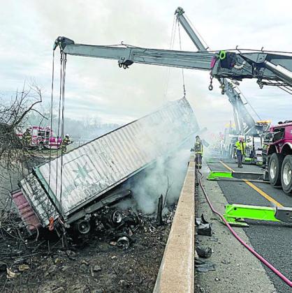 Cranes hoist the trailer from the creekbed as part of the cleanup that continued throughout Monday morning after the accident. Photo Courtesy of SVFD