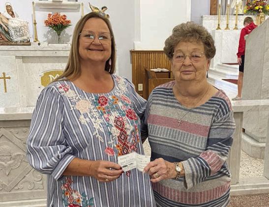 KJZT Society 66 of Weimar/Schulenburg recently held a bakeless bake sale, with part of the proceeds presented to St. Rose of Lima Catholic School in Schulenburg. Presenting the check to St. Rose principal Rosanne Gallia (left) is Kathy Bertsch (right), Society 66 vice president.