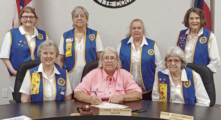 A proclamation designating May 23 as “Poppy Day” in Schulenburg was signed by Mayor Connie Koopmann in the presence of American Legion Auxiliary Unit 143 representatives. Shown are (front row, from left) Patricia Hranicky, Auxiliary vice president; Mayor Connie Koopmann; Peggy Fish, Auxiliary president; (back row) Dana Bartosh, Auxiliary member; Debora Behlen, treasurer; Sandi Guthrie, sergeant-at-arms; and Patricia Marty, historian.