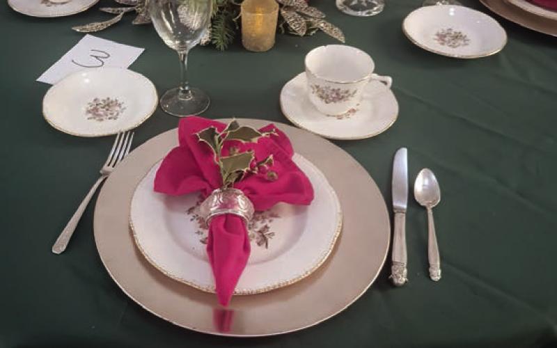 The winner of a contest in which teams of four Garden Club members created festive Christmas party table settings was table No. 3.