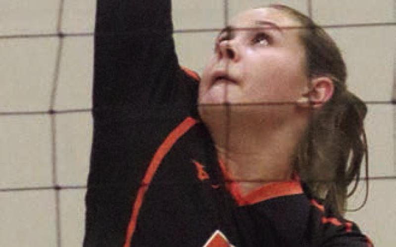 Haylee Vacek sends down an uncontested kill in the first set on her way to 16 in the match. Sticker Photo By Darrell Vyvjala