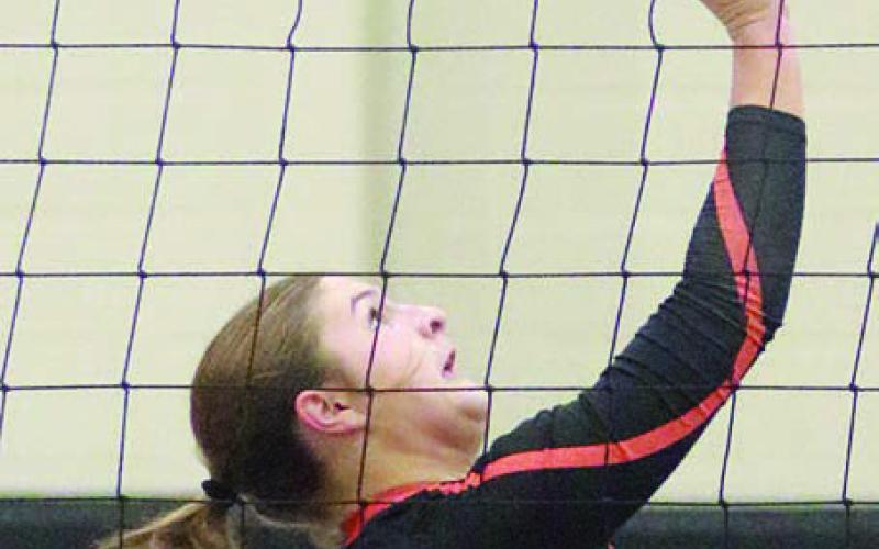 Landry Zapalac gets to a pass near the net to make a onehanded set in game one. Sticker Photo By Darrell Vyvjala