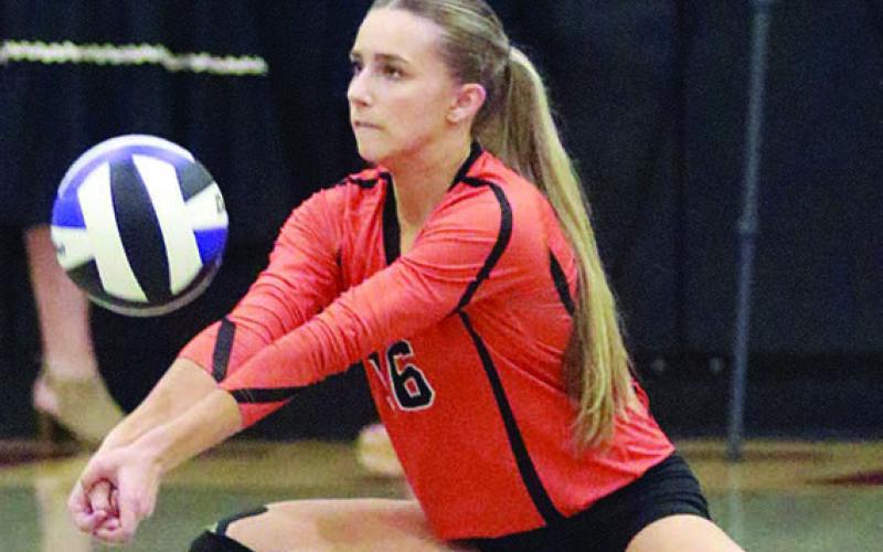 Jenna Guentert gets a dig in set one. Sticker Photo By Darrell Vyvjala