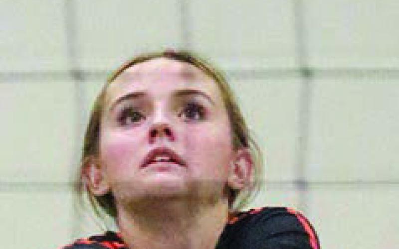 Miranda Bonner passes on serve receive in game one. Sticker Photo By Darrell Vyvjala