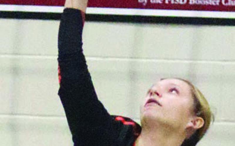 Michaela Kollmann serves an ace to end the first set. Sticker Photo By Darrell Vyvjala