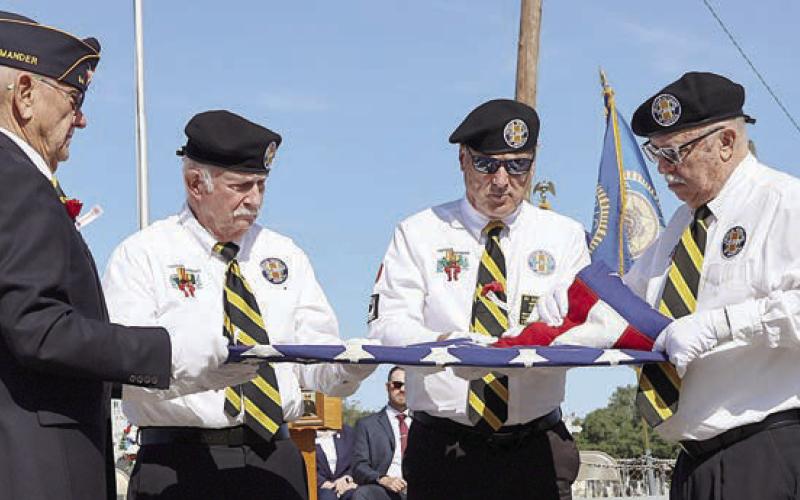 Participating in the folding of the flag ceremony were (from left) Flatonia American Legion Post 94 commander Danny Vyvjala, Vietnam Veterans of America Chapter 870 members Larry Hoffman and Donnie Christen, and Vietnam Veterans of America Chapter 870 president Andy Janda.