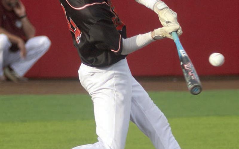 Eli Blansitt sends an single to left field to drive in the Horns’ only run in the top of the seventh inning. Sticker Photo By Darrell Vyvjala