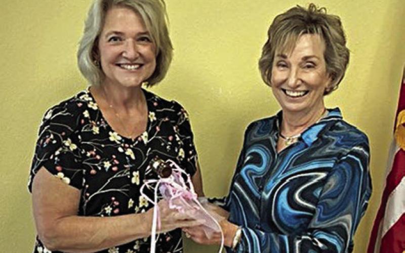 Accepting the president’s gavel from outgoing president Diana Mikesky (right) is Sue Broadwater (left).