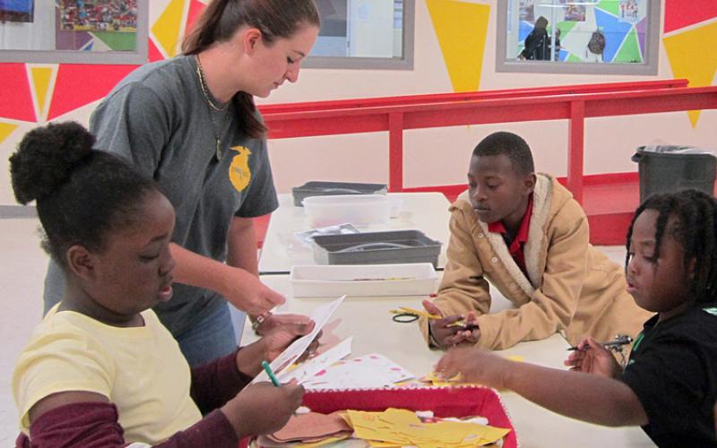 Ussery-Roan Texas State Veterans Home in Amarillo – Elizabeth Williams (sitting left), Cash Wade (front right) and Ju’Varyon Middleton (back right) assist Liberty Killion (standing left).