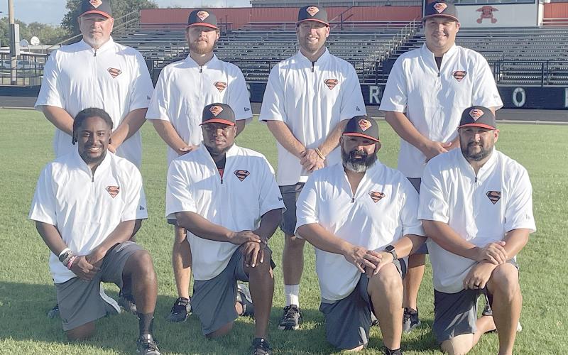 SHORTHORN COACHING STAFF: Kneeling, from left: Jaylen Samuels, Brandon Williams, Isaiah Barrera, and Cameron Besetzny. Standing, from left: Brad Oden, Jordan Hafley, head coach Luke Hobbs, and Marty Bigham. Sticker Photo By Darrell Vyvjala