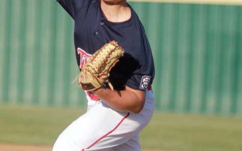 Nolan Morgan delivers a pitch early in Friday’s game. Sticker Photo By Darrell Vyvjala