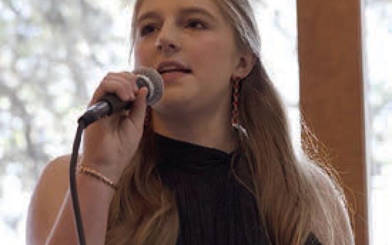 Reagan Moreau speaks on behalf of her father, Craig, at the forum. Photo By Melanie Berger / Courtesy of Flatonia Argus