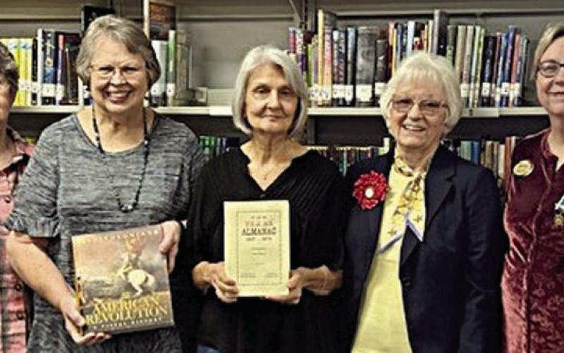 Presentation at Flatonia Public Library – Judy Syler, Flatonia Public Library; Carolyn West, Flatonia Public Library board member; Barbara Rogers, Flatonia Public Library board member; Carolyn Caflisch, Smith-McMillan Chapter regent; and Kim Joost, Smith-McMillan Chapter librarian.