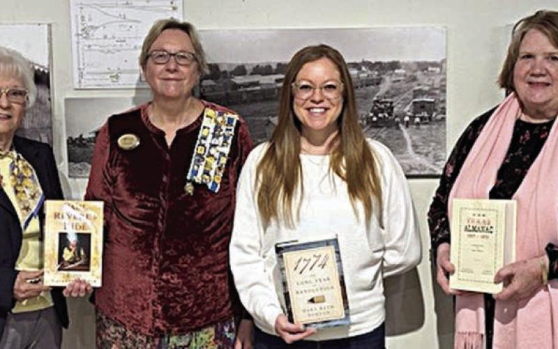 Presentation at Fayette Public Library/ Fayette Heritage Museum &amp;amp;Archives – (from left) Carolyn Caflisch, Smith-McMillan Chapter regent; Kim Joost, Smith-McMillan Chapter librarian; Allison MacKenzie Hollek, Fayette Public Library (La Grange) director; and Rox Ann Johnson, Fayette Heritage Museum &amp;amp; Archives archivist.