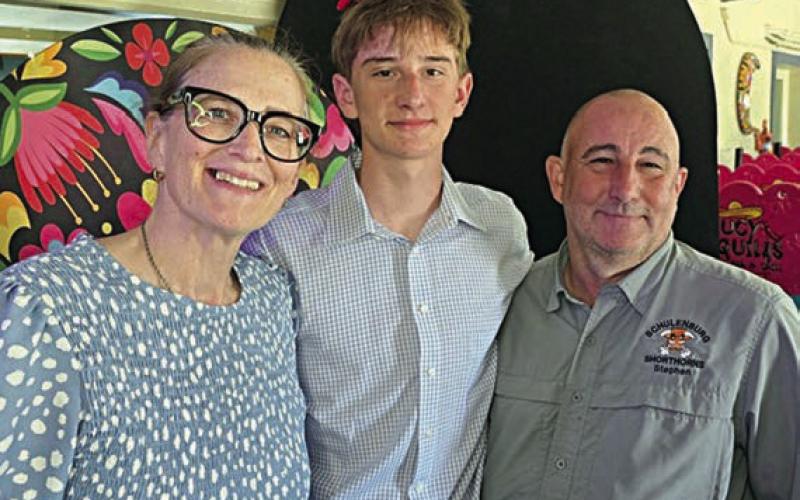 Jamison Bennett (center), scholarship winner, along with his mother Maura Bennett (left) and his father Stephen Bennett (right).