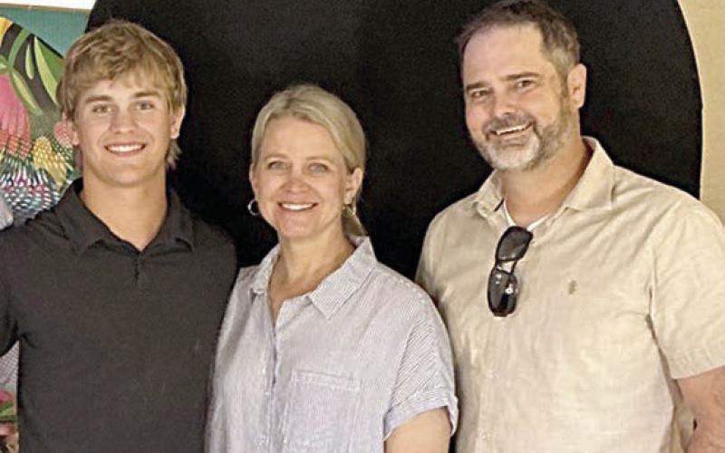 Emerson Harvey (left), scholarship winner, along with his mother Katie Harvey (center) and his father Barrett Harvey (right).