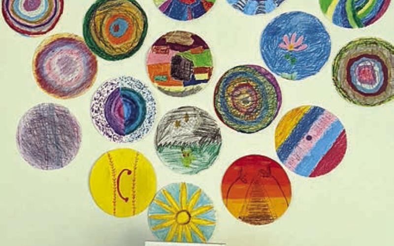Below artwork created by the Arts for Rural Texas art-after-school class at Sacred Heart School in La Grange is “sensory dot dough” in a glass container. Visitors to the International Dot Day celebration were welcomed to remove the dough from the container and touch it.