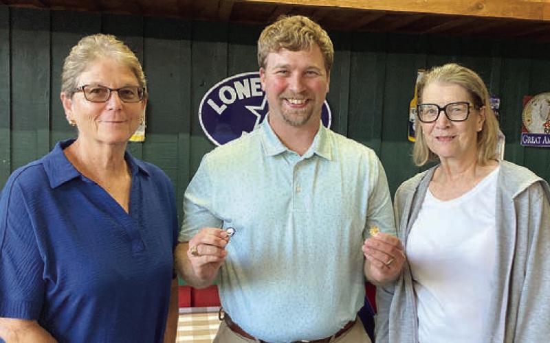 Year pins were presented to Mary Krupala (left), 60-year pin, and. Mary K. Seifert (right),70-year pin, by agent Kyle Hartmann (center).