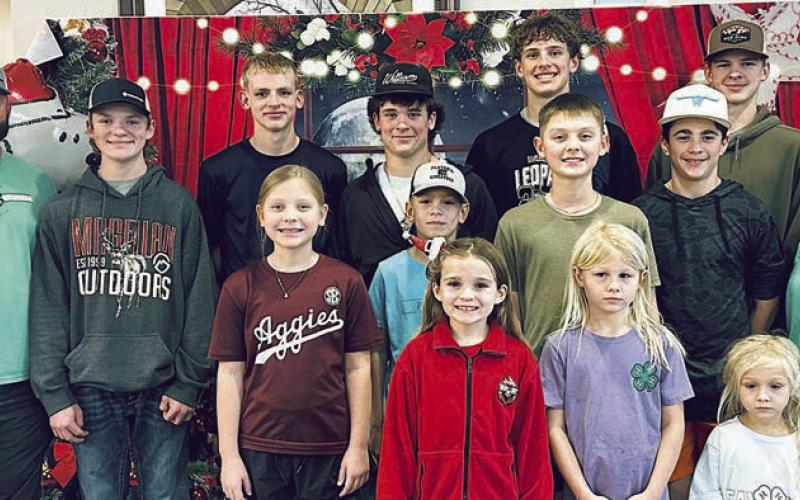 Shown at Monument Hill Nursing Home are (front row, from left) Lillian Muras, Allie Zbranek, Naomi Zbranek, (middle row) Cooter Maxwell, Ty Maxwell, Coral Hrbacek, Luke Zbranek, Rowdy Hrbacek, Collin Horton, Ashley Conrad, (back row) Quade Brothers, Casen Conrad, Koen Zbranek and James Zbranek.