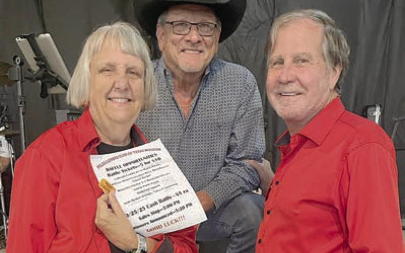 In the drawing, first prize, a $50 Majek Wine Gift Certificate, went to Kenneth Kristynik (center), band leader. Presenters were Jan Koehn (left), PLCTM vice president, and Gary Bucek (right), PLCTM president.