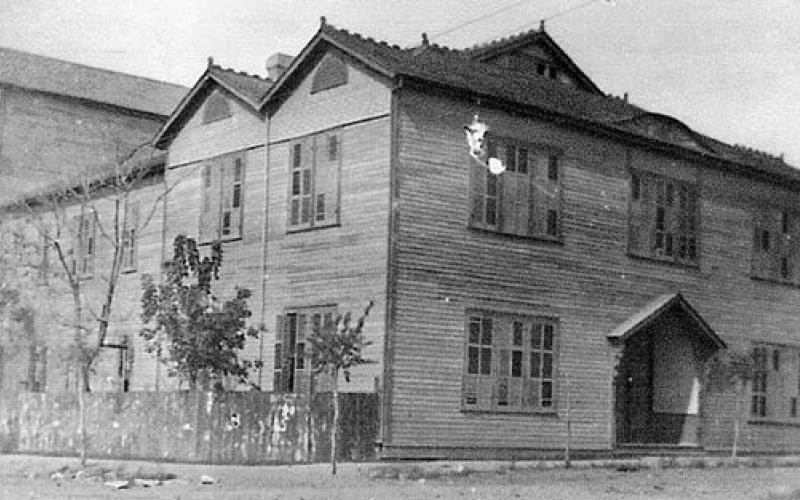 The St. Patrick’s Day program was given at the La Grange Opera House, located at the northwest corner of the intersection of Franklin and Colorado streets, where the city hall now stands. The front area along Franklin Street was a library and meeting room. The stage area was at the back of the building, with the audience seated in between on both the ground floor and on a large horseshoeshaped gallery or balcony overhead.