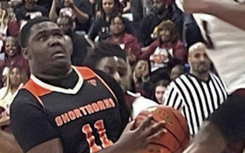 Tavondrick Ellison gets an Eagle in the air to draw a foul in the third quarter. Sticker Photo By Darrell Vyvjala