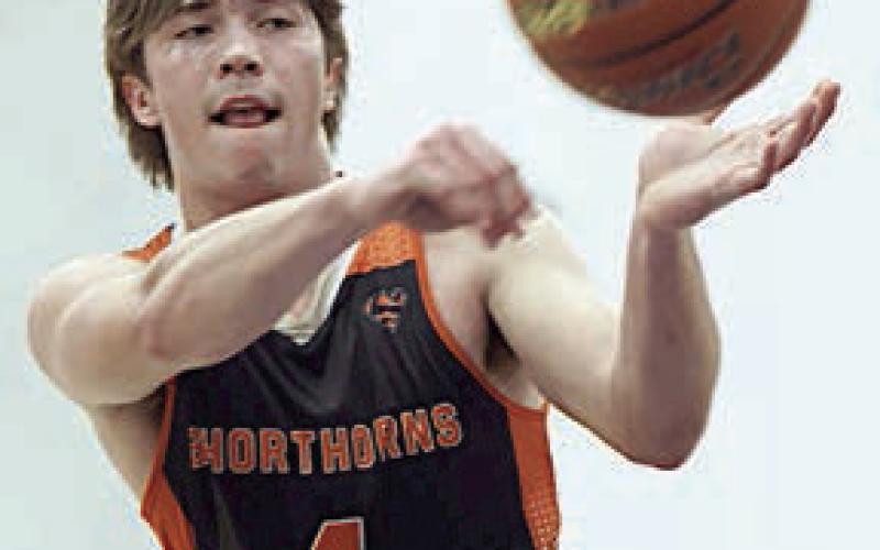 Jayse Janda dishes to a teammate in the fourth quarter. Photo By Ricky Toro
