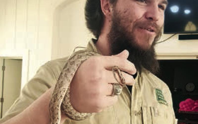 Speaker was E. Drake Rangel (left photo) of Texas Parks &amp;amp; Wildlife, who discussed snakes. Member Jan Ripper (right photo) holds a snake during the program.