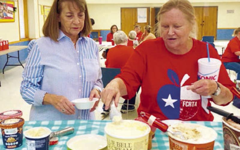Enjoying ice cre am with a variety of topping at the FCRTA social were Patty Ehler and Donna Burton.