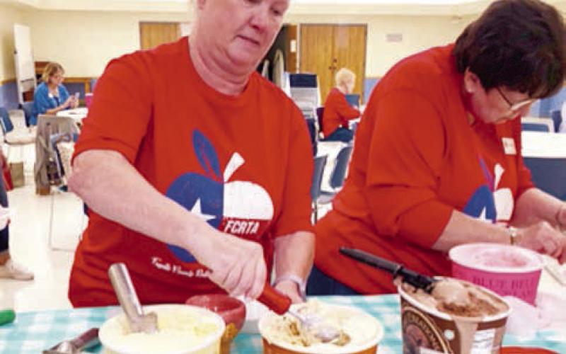 Prep aring sundaes with all the fixings were Lisa Slinkard and Jeanne Wetjen.