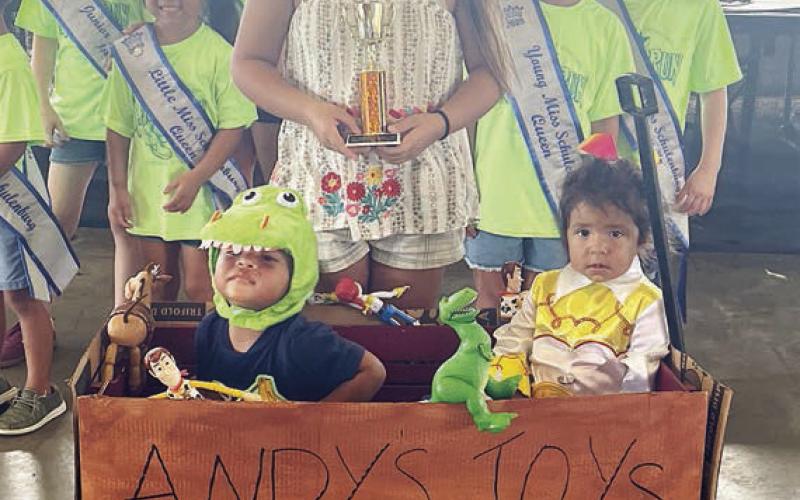 Third Place – “Andy’s Toy Box” - Zailynne, Bellamy, and Oaklyn Manzano. Sticker Photo By Darrell Vyvjala
