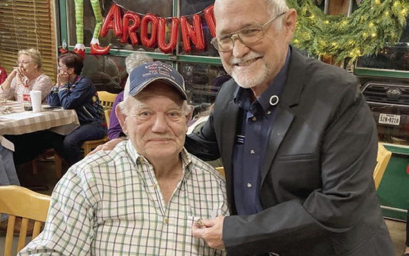 A 60-year membership pin was presented to Raymond Dittrich (left) by Hermann Sons Life Grand Lodge board member David Noak (right).