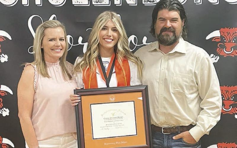 Chayse (center) was presented the salutatorian plaque with her parents, Kirsten and Daniel Deagen alongside her, at last Thursday’s Senior Scholarship Banquet. Sticker Photo By Darrell Vyvjala