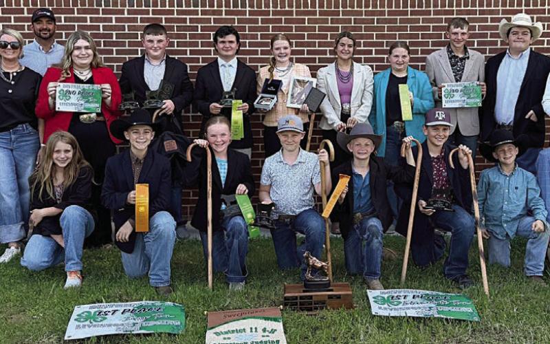 Fayette County 4-H’ers participating in the District 11 4-H Livestock Judging Contest were (front row, from left) Hayleigh Pizzitola, Crockett Guenther, Abigale McBride, Jehnsen Janecka, Joe Carrales, Hudson Holub, Rowdy Guenther, Tate Fritsch, (back row) Hailey Janish, coaches Kaci and JoJo Carrales, Rheagan Karisch, Abraham McBride, Logan Poncik, Kaisley Janecka, Adalyn Carrales, Brealey Nieto, Holden Holub, Rilan Karisch, Tatum Fritsch and Keeley Warnken.