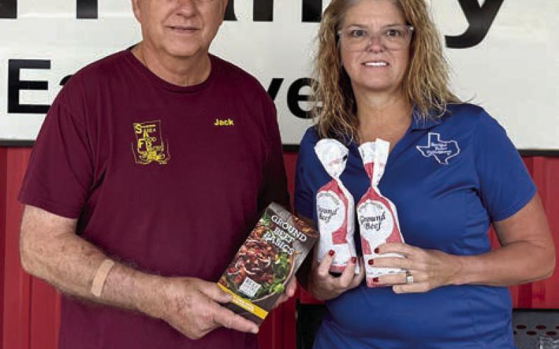 Presentation to Schulenburg Area Food Pantry – (from left) Jack Niesner, SAFP vice president, and Tanya Schindler, NVCW past president.
