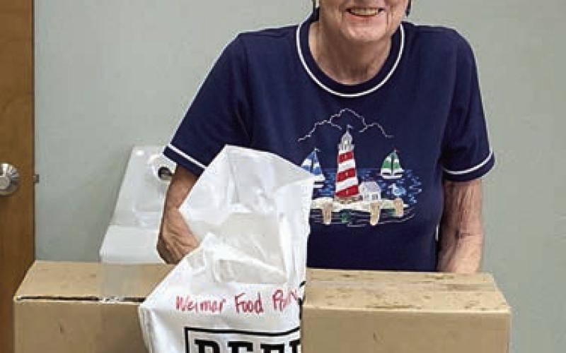 Presentation to Weimar Food Pantry – Evelyn Thuemler, pantry volunteer, received the donation from Dani Stock, NVCW volunteer.