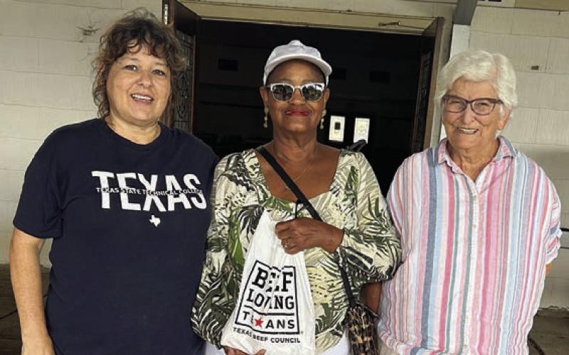 Presentation to Consider Love Food Pantry, Weimar – (from left) Cindy Templeton, Consider Love Food Pantry founder; Jacqueline Figg, NVCW pantry donation chair; and Zoe Justiss, NVCW volunteer.