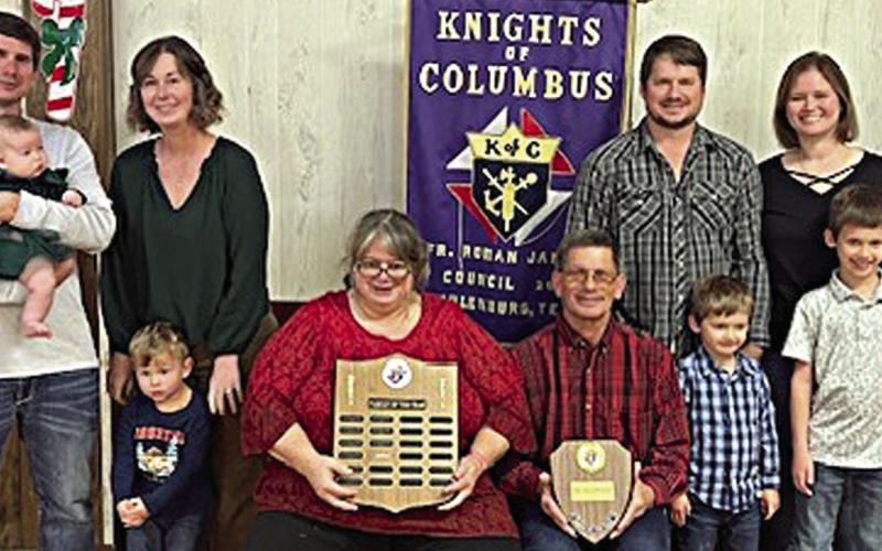 SCHULENBURG KC Family of the Year for 2025 was awarded to the Shimek family – Mark and Cynthia Shimek shown with their sons and families along with KC Council 2902 representatives – (from left) KC financial secretary Rodney Kalich; Richard Shimek holding baby Maeve, Ashley Shimek with Roman standing in front of her, Cynthia and Mark Shimek holding plaques, Raymond Shimek with Asher standing in front of him, and Jamie Shimek with Luke standing in front of her; and KC grand knight Paul Zapalac.