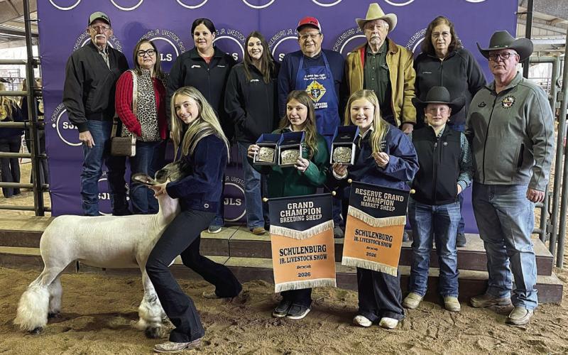 RESERVE CHAMPION MARKET SHEEP – Exhibitor: Kimber Bartosch (front, left). Sale price: $6,500. Sticker Photo By Darrell Vyvjala