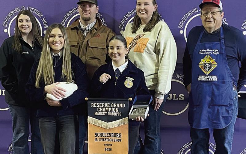 RESERVE CHAMPION MARKET RABBITS – Exhibitor: Greenli VanZandt (front, left). Sales price: $4,725. Sticker Photo By Darrell Vyvjala