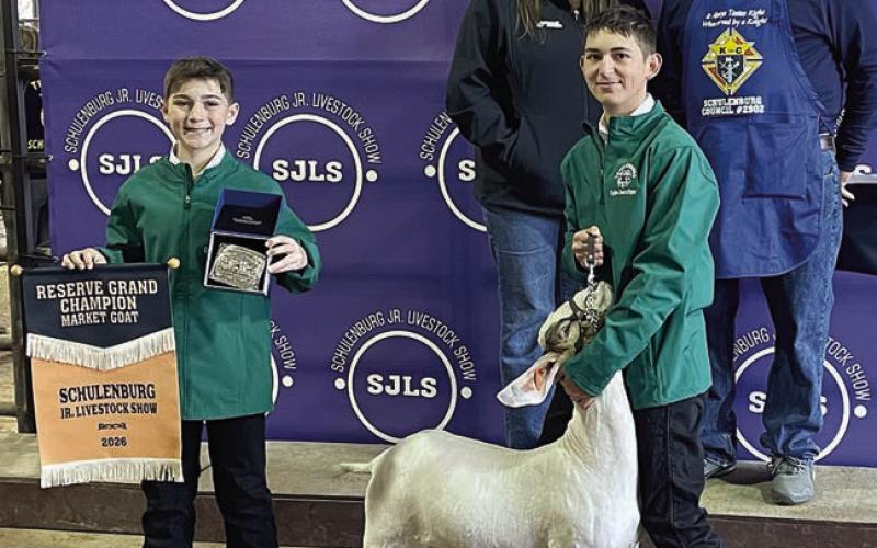 RESERVE CHAMPION MARKET GOAT – Exhibitor: Dylan Zweschper (front, right). Sale price: $4,000. Sticker Photo By Darrell Vyvjala