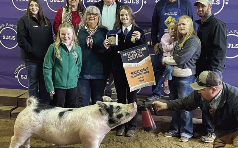 RESERVE CHAMPION MARKET SWINE – Exhibitor: Abigale McBride (front, left). Sale price: $10,350. Sticker Photo By Darrell Vyvjala