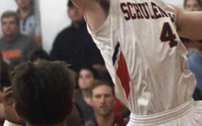 Jayse Janda snags an offensive rebound in the first quarter against Ganado. Sticker Photo By Darrell Vyvjala