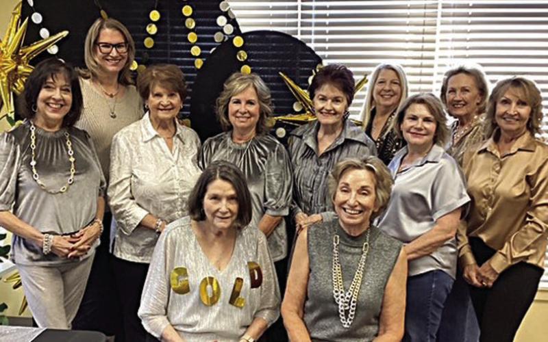 Dressing for the silver and gold theme were a number of attendees, including (front row, from left) Tricia Marty, Diana Mikesky, (back row) Barbara Moellenberndt, Amy Lanouette, Lily Hilscher, Connie Kocurek, Betty Herzik, Suzette Surman, Pam Janda, Sharon Rodriguez and Veronica Smith.