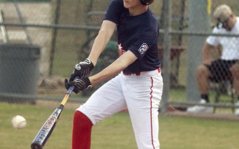 Austin Reeves connects for a hit in the fifth inning last Wednesday. Sticker Photo By Darrell Vyvjala