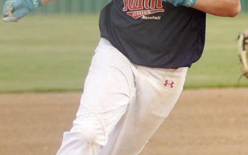 Will Herzik rounds third and heads home with a run in the top of the fourth inning of game one. Sticker Photo By Darrell Vyvjala