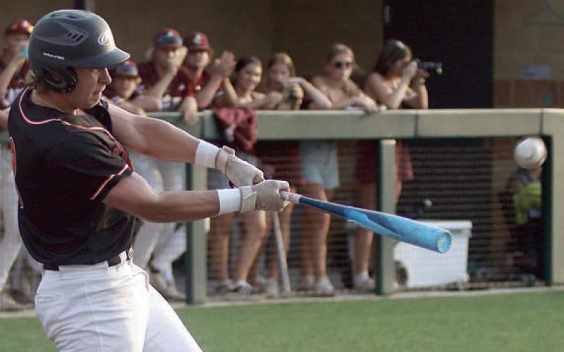 Aaron Janecek sends a double to left-centerfield in the top of the first inning, when he scored the game’s only run. Sticker Photo By Darrell Vyvjala