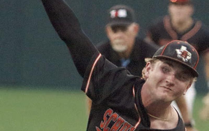 Brycen Schramek delivers a strikeout pitch to get out of a jam in the fourth inning. Sticker Photo By Darrell Vyvjala