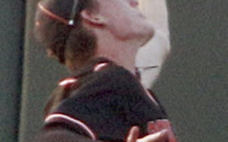 Zane Brenek reaches up to snag a fly ball in the right field corner in the second inning. Sticker Photo By Darrell Vyvjala
